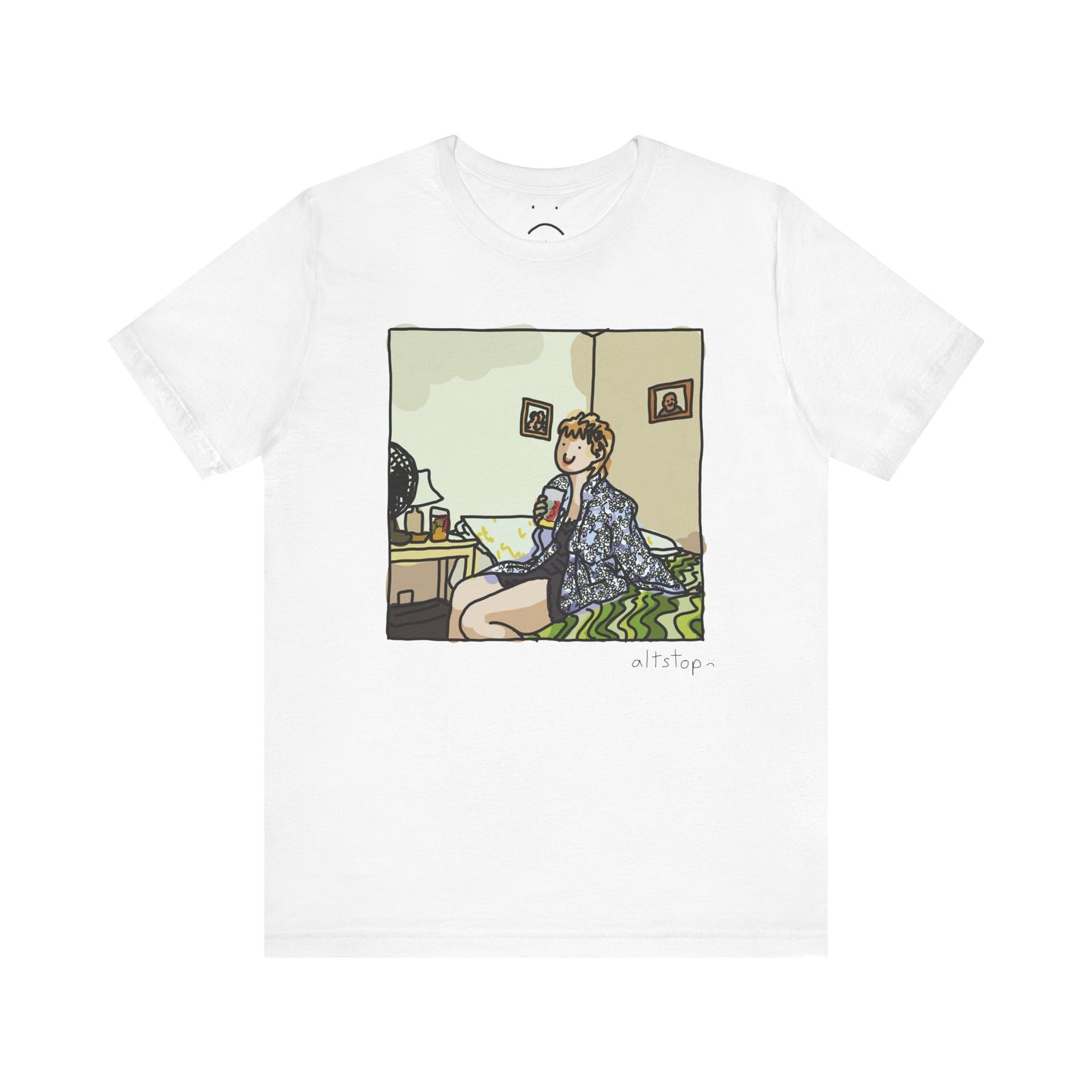 gorl with a cup on a bed deluxe tee