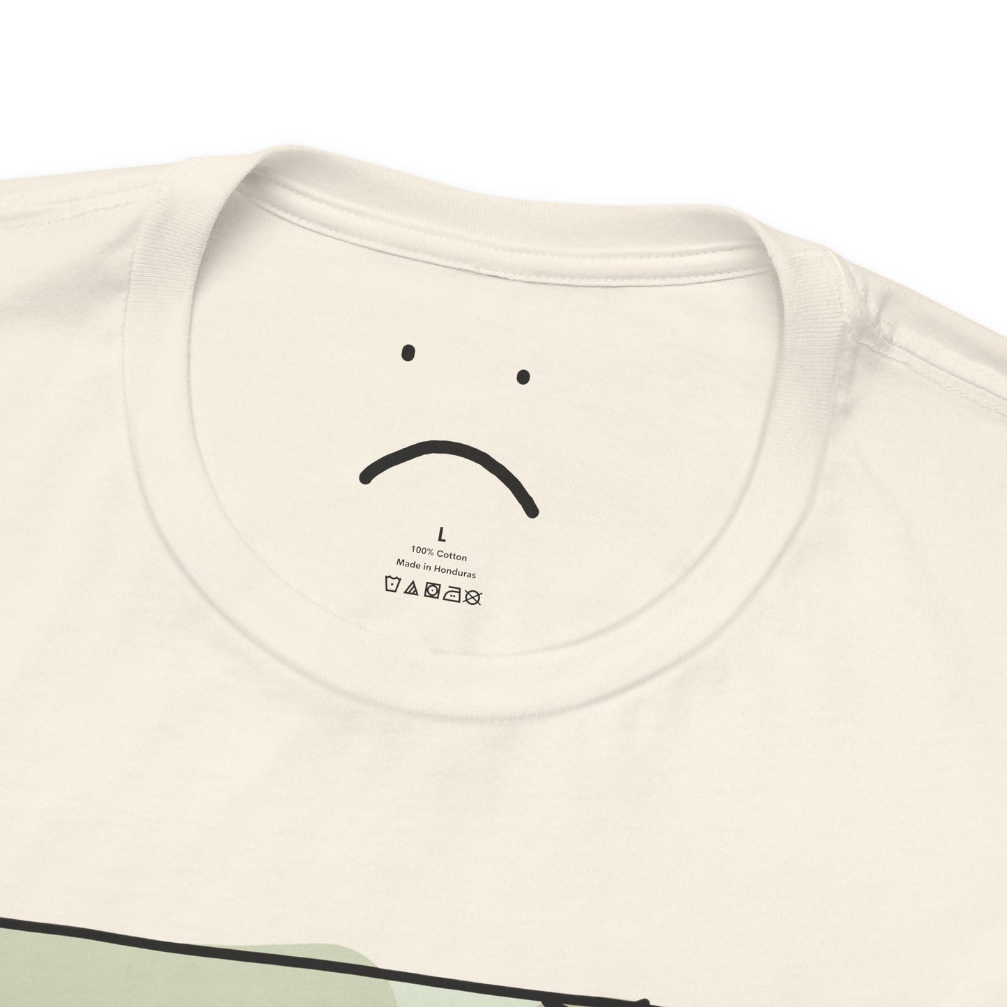 gorl with a cup on a bed deluxe tee