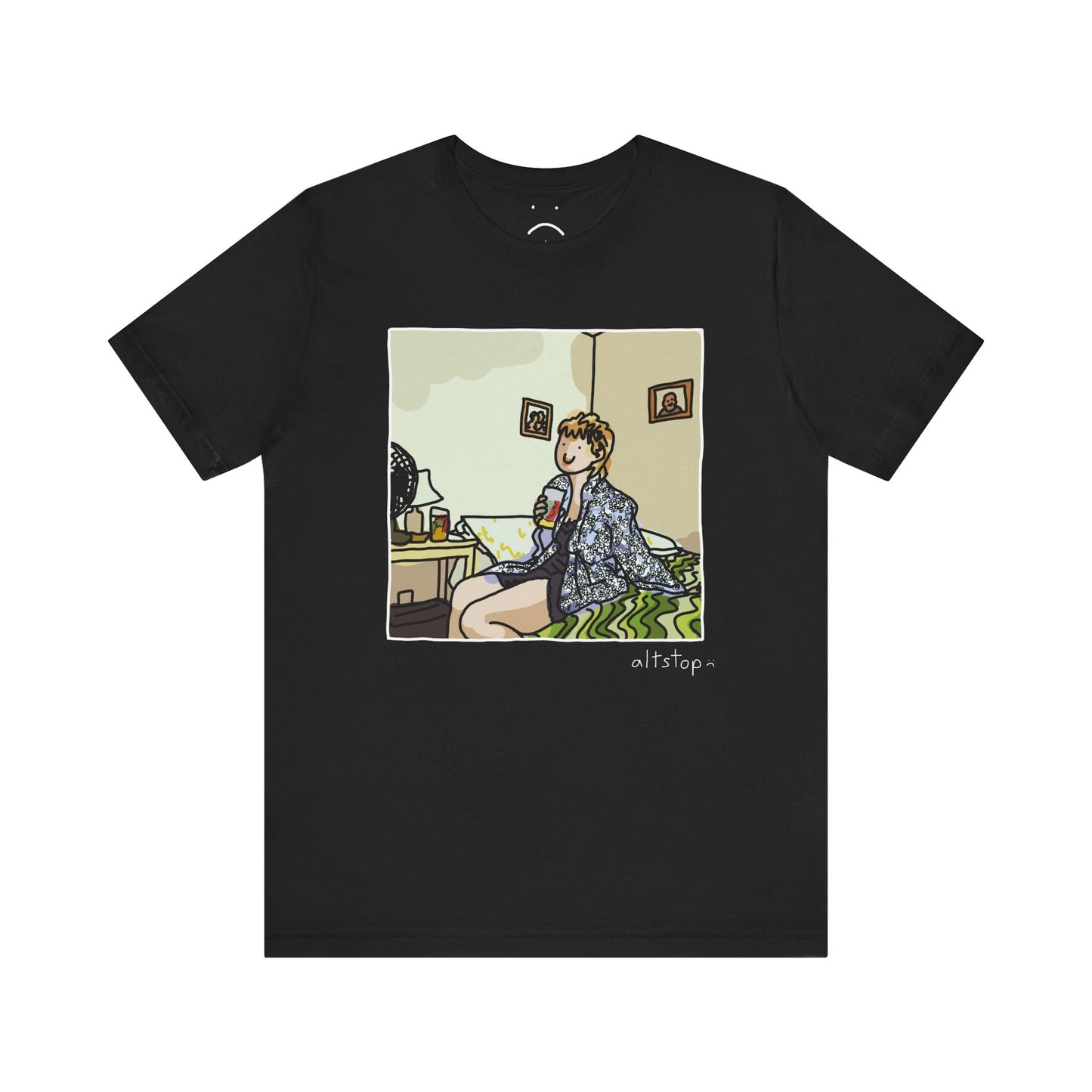 gorl with a cup on a bed deluxe tee