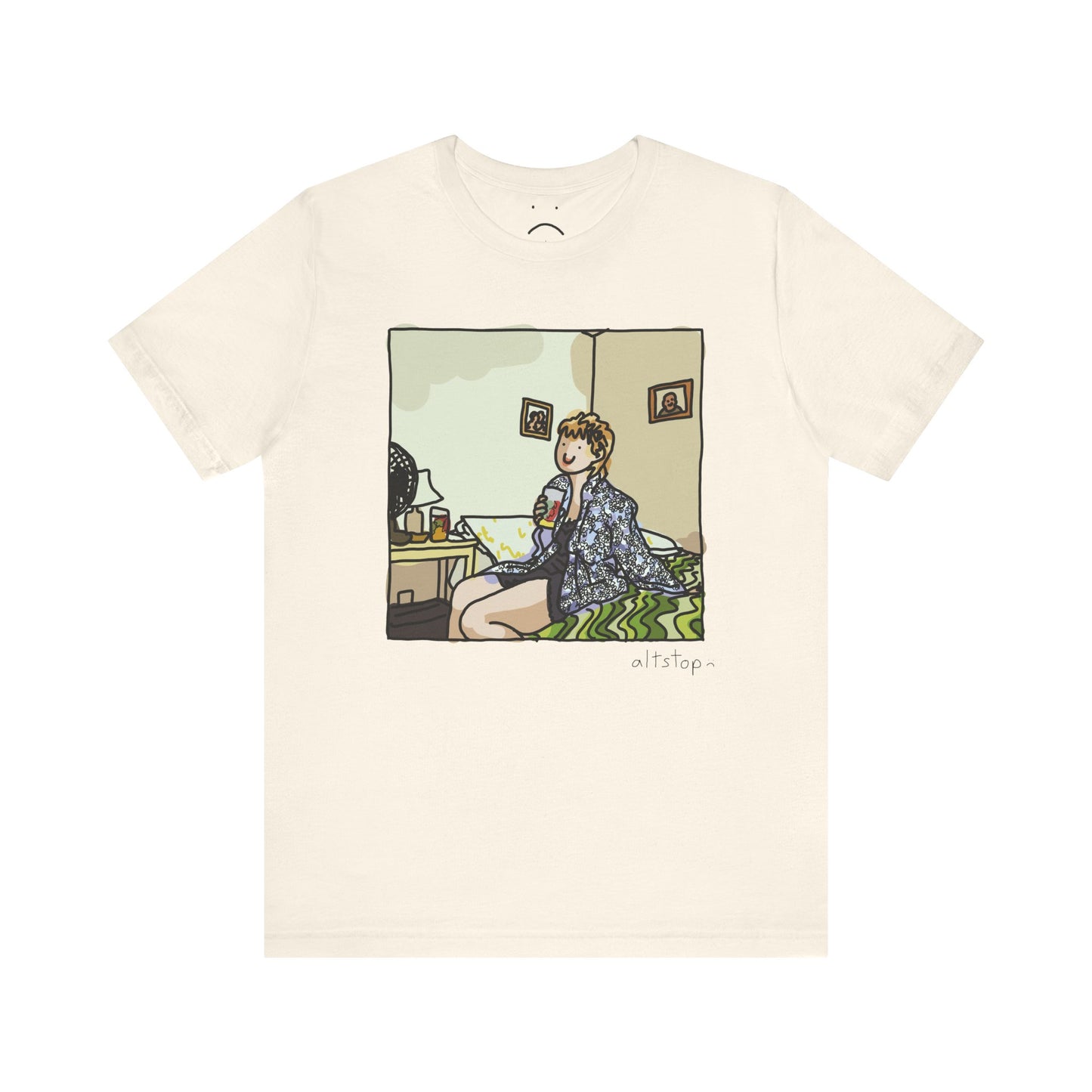 gorl with a cup on a bed deluxe tee
